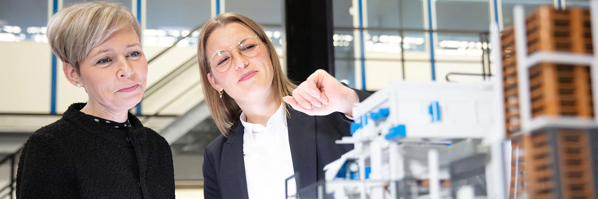 Christin Wölk, Senior Sales Manager from Germany, on the right, explains the product to a customer